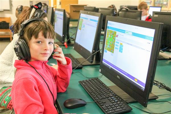 A third-grade girl works on a Minecraft project during a computer coding lesson in the Fairley computer lab. A third-grade girl works on a Minecraft project during a computer coding lesson in the Fairley computer lab.